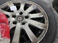 4 tweedehands winterbanden op hankook aluminium velg (afmetingen: 215/70 r16 100t) - afbeelding 6 van  6