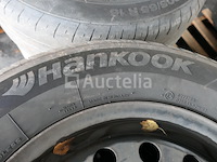 4 tweedehands winterbanden op hankook stalen velg (afmetingen: 215/70 r16 100t) - afbeelding 3 van  6