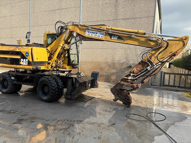 Caterpillar - 2000 - m315 - banden graafmachine - afbeelding 1 van  10