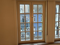 Dubbel opendraaiend pvc raam met onderverdeling