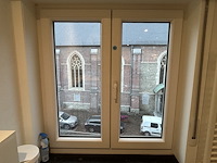 Dubbel opendraaiende pvc raam beige (dubbel glas) - afbeelding 1 van  5
