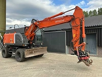 Hitachi zaxis 140w banden graafmachine - afbeelding 1 van  17