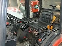 Kubota tractor met schaaf en strooier - afbeelding 19 van  22