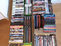 Lot 157 - dvd’s en xbox games. 4 dozen