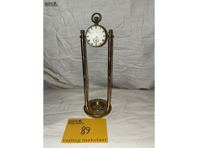 Lot 89 - glazen tafeluurwerk op bronzen voet met kompas, travertal sw - afbeelding 1 van  4