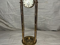 Lot 89 - glazen tafeluurwerk op bronzen voet met kompas, travertal sw - afbeelding 1 van  4