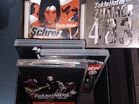 Lot 92 - kistje tokio hotel met inhoud - afbeelding 2 van  4