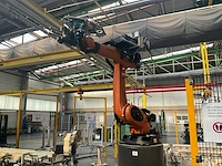 Rollenhandelinginstallatie jurgens met robot kuka kr 150