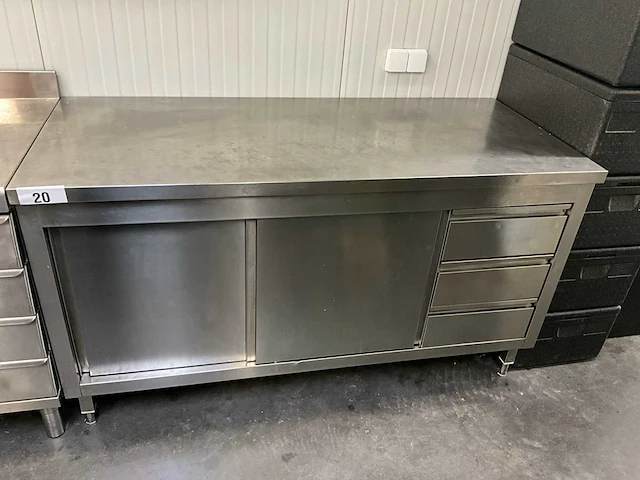 Rvs werktafel voorzien van 2 schuifdeuren en 3 laden - afbeelding 1 van  2