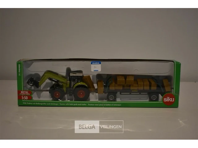Siku schaalm. traktor met balengrijper in originele doos 1/50 - afbeelding 1 van  1