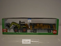 Siku schaalm. traktor met balengrijper in originele doos 1/50 - afbeelding 1 van  1