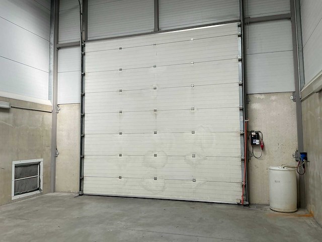 2006 l-door st6 elektrische bediende sectionale poort - afbeelding 1 van  5