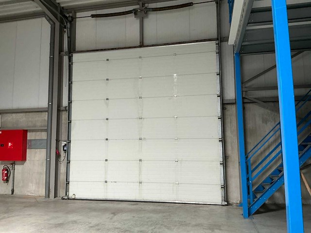 2006 l-door st6 elektrische bediende sectionale poort - afbeelding 1 van  7