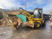 2012 komatsu pw118mr-8 wielgraafmachine - afbeelding 1 van  20
