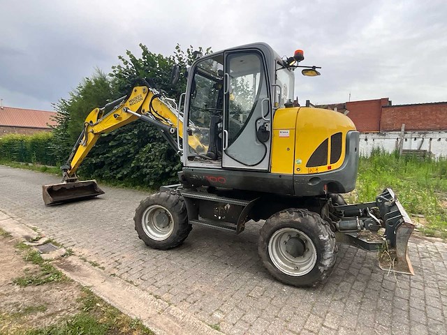 2021 wacker neuson ew100 - banden graafmachine - afbeelding 1 van  40