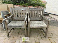 ± 6 houten tuinstoelen