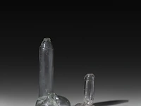 A blown glass phallus flask, england, late 19thc, and a matching folkloric glass phallus, montevideo, uruguay, h 16 - 30 cm