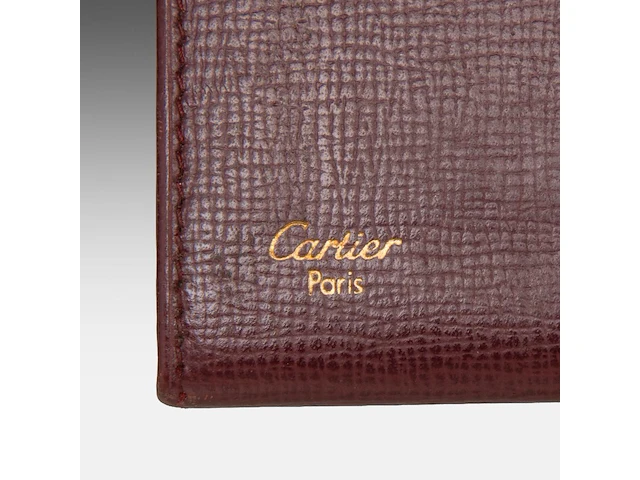A cartier burgundy 'trinity' top handle bag, wallet and two 'must de cartier' wallets - afbeelding 2 van  16