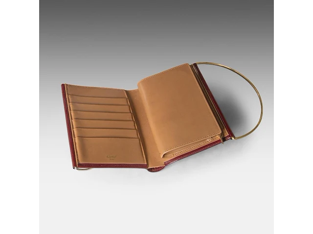 A cartier burgundy 'trinity' top handle bag, wallet and two 'must de cartier' wallets - afbeelding 5 van  16