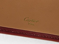 A cartier burgundy 'trinity' top handle bag, wallet and two 'must de cartier' wallets - afbeelding 6 van  16