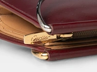 A cartier burgundy 'trinity' top handle bag, wallet and two 'must de cartier' wallets - afbeelding 7 van  16