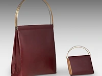 A cartier burgundy 'trinity' top handle bag, wallet and two 'must de cartier' wallets - afbeelding 11 van  16