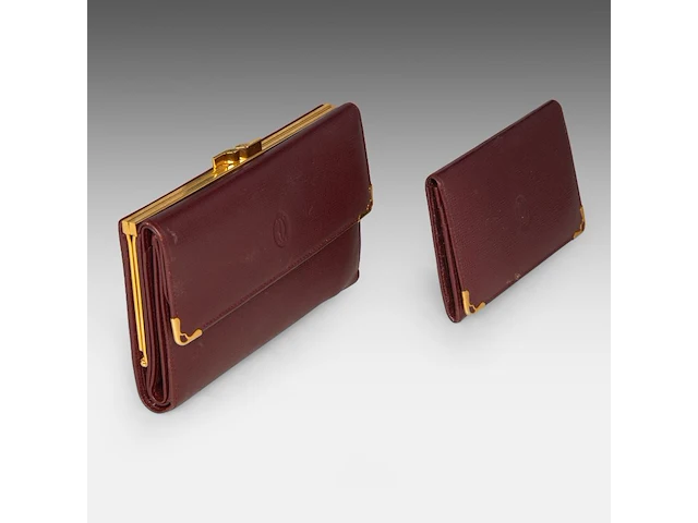 A cartier burgundy 'trinity' top handle bag, wallet and two 'must de cartier' wallets - afbeelding 12 van  16