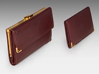A cartier burgundy 'trinity' top handle bag, wallet and two 'must de cartier' wallets - afbeelding 12 van  16