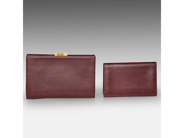 A cartier burgundy 'trinity' top handle bag, wallet and two 'must de cartier' wallets - afbeelding 15 van  16