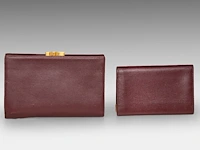 A cartier burgundy 'trinity' top handle bag, wallet and two 'must de cartier' wallets - afbeelding 15 van  16