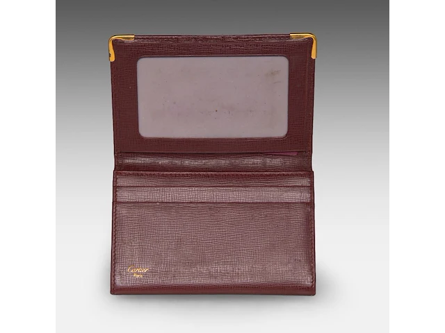 A cartier burgundy 'trinity' top handle bag, wallet and two 'must de cartier' wallets - afbeelding 16 van  16