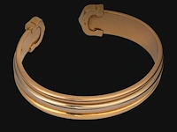 A cartier ressort 'double c' bracelet in 18ct yellow gold and diamonds, weight: 26,9 g (+) - afbeelding 2 van  8