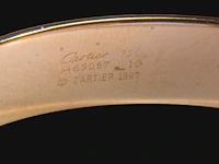 A cartier ressort 'double c' bracelet in 18ct yellow gold and diamonds, weight: 26,9 g (+) - afbeelding 3 van  8