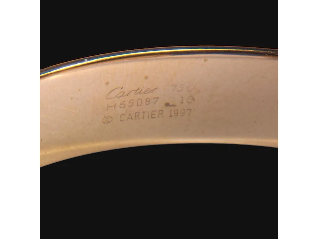 A cartier ressort 'double c' bracelet in 18ct yellow gold and diamonds, weight: 26,9 g (+) - afbeelding 7 van  8