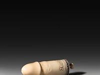 A carved sperm whale ivory phallic snuff box, late 19thc, l 13 cm