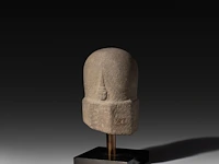 A carved stone lingam, khmer, cambodia, 8thc 20 x 12 cm. (7.87 x 4.71 in.)