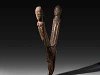 A carved wooden fertility statue of a couple having intercourse, lobi people, burkina faso 58 cm. (22.82 in.)