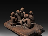 A carved wooden group depicting a circumcision ritual, luba people, r.d. congo, 20thc 10 x 23 cm. (3.94 x 9.06 in.)