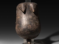 A carved wooden ritual hermaphrodite belly mask, makonde people, tanzania 45 cm. (17.71 in.)