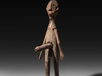 A carved wooden tribal puppet with an erection, zunu people, d.r. congo 58.5 cm. (23.03 in.)