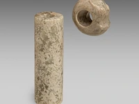 A chinese archaic jade tubular bead and a 'zhulong (pig dragon)' pendant, neolithic period, hongshan culture, l 5,4 cm / ø 2,2 cm