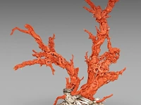 A chinese coral carving, depicting birds on prunus branches, late qing, fixed on a metal foot, total weight about 1950g - total h 36,5 x l 34 cm