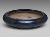 A chinese flambé-glazed shiwan ware narcissus bowl, seal stamped by the artist gao de jian, republic period, ø 40 cm