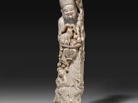 A chinese ivory sculpture of an immortal with a fruit basket, signed, late qing dynasty (1850-1912), h 41 cm - 2066g (+)