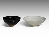 A chinese jian ware and a qingbai ware tea bowl, ø 11,2 - h 5 cm / ø 14 - h 4,8 cm