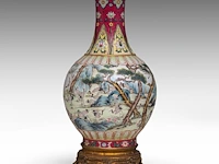 A chinese sgraffito carved ruby-red enamel, and famille rose 'one hundred cranes' bottle vase, republic period, total h 37 cm (fixed to a bronze base)