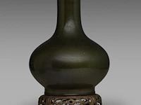 A chinese tea-dust glazed bottle vase, marked guangxu and of the period, fixed on a bronze base, total h 36 cm