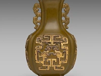 A chinese tea-dust 'kui dragon' quatrefoil fanghu vase, paired with stylised dragon handles, with a qianlong mark, h 17,5 cm