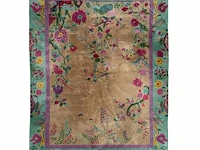 A chinese woollen rug, decorated with flower branches and various birds 358 x 268 cm. (140.93 x 105.51 in.)