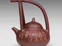 A chinese yixing zisha high handled teapot and cover, incl. inscriptions, marked, total h 16 cm